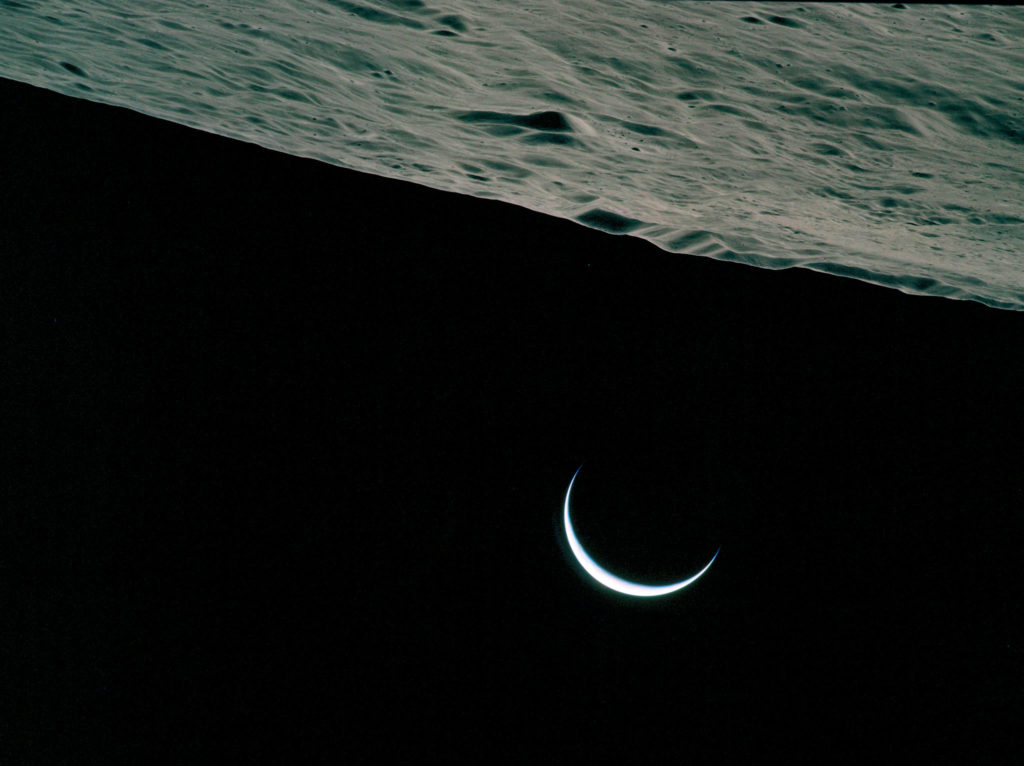 A crescent Earth, photographed by the Apollo 15 astronauts while orbiting the Moon.